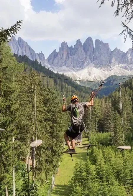 High ropes course adventure in Luson: family fun with breathtaking view of Peitlerkofel and Dolomites